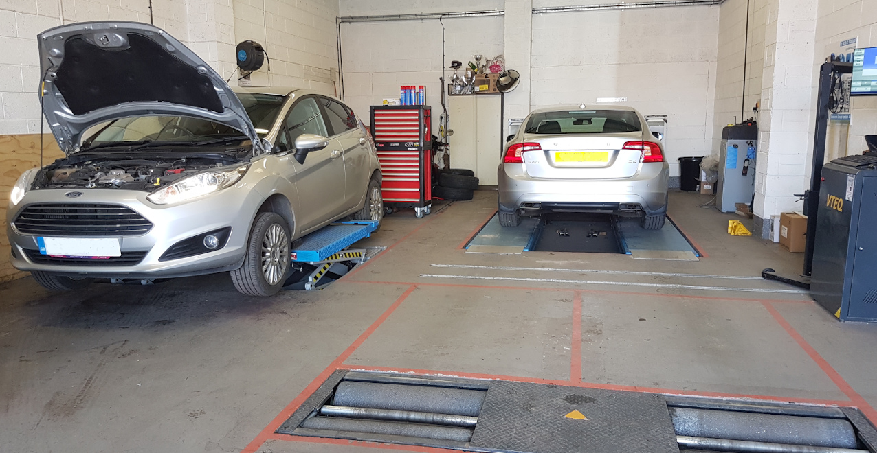 MOT bay with brake rollers inside the Tom Laycock Motors workshop